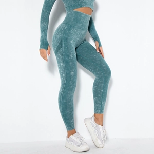 Detail of acid-wash seamless yoga set featuring ribbed texture and lifting leggings