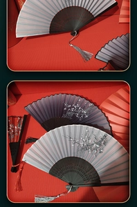 Detailed view of silk folding fans with floral patterns, bamboo ribs and silver tassels