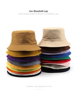 Flat lay display of various color options for the wide brim cotton bucket sun hat