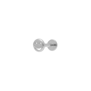Detail of silver S925 smiley face labret stud with a flat back piercing design