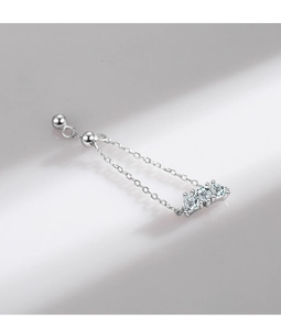 Detailed close-up of a silver chain earring featuring three sparkling zircon gemstones