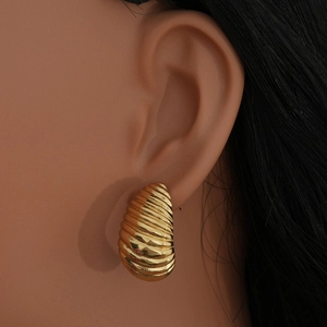 Chic vintage style gold stainless steel croissant hoop earrings for women on model