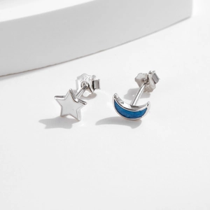 Asymmetric S925 sterling silver moon and star stud earrings with blue enamel detailing
