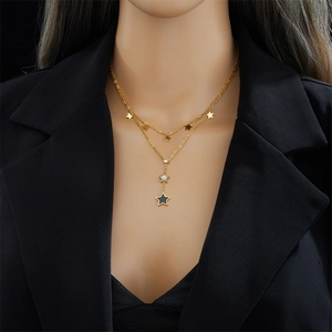 Elegant gold double-layered titanium steel necklace with star pendants on black blazer