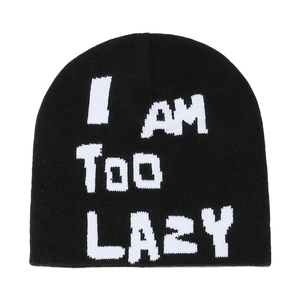 Black knit beanie featuring white I AM TOO LAZY jacquard text in a minimalist winter style