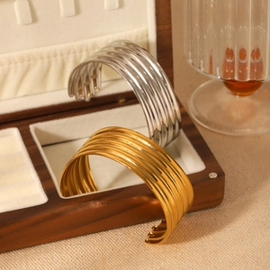 Polished layered stainless steel cuff bracelets in gold and silver finish for women