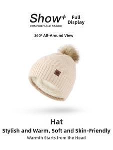 Close-up of beige knit hat showing thick faux sheepskin lining and snowflake leather patch