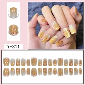 Golden cat-eye gradient press-on nails with glitter firework patterns, 24 pieces set