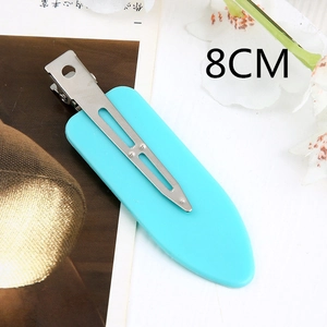 Detail view of 8cm cyan acrylic duckbill hair clip with silver metal base and glossy finish