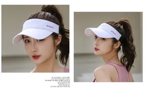 Detail of white sports sun visor with lavender embroidery on breathable quick-dry fabric
