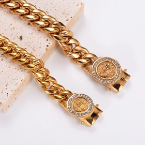 Gold stainless steel Cuban link bracelet with a lion head relief and sparkling rhinestones