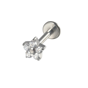G23 titanium labret stud with a clear zircon flower top and flat back on white background