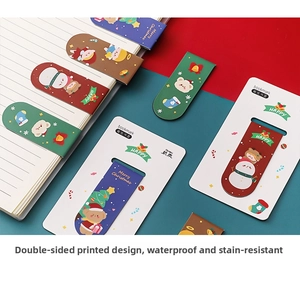 Close-up of waterproof magnetic Christmas bookmarks featuring cartoon snowman and reindeer