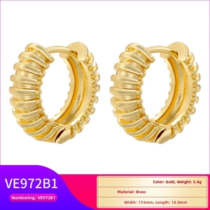 Macro detail of gold-plated brass hoop earrings with textured ripple finish and dimensions