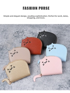 Close-up of cat-shaped litchi grain leather purses with cat tail metal zipper pullers