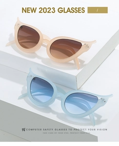 Macro detail of cat-eye frames with crystal accents and gradient lenses for eye protection