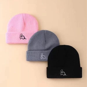 Three kids knitted beanies in pink grey black with cute dinosaur embroidery for autumn winter