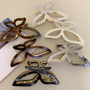 Set of 6 butterfly acetate hair claws in various marble and amber colors for women