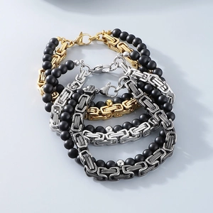 Three men's byzantine chain bracelets in gold, silver, and gunmetal with black matte beads