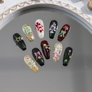 Christmas press-on nail set with matte dark green, burgundy, and glitter festive patterns