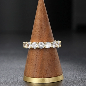Classic 4mm gold plated ring with round clear zircon stones in a shared prong setting