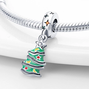 Macro view of Christmas tree charm with green enamel and sparkling zirconia on snake chain