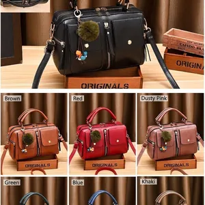 Retro multi-color PU leather satchel collection with twin pockets and pom-pom charm