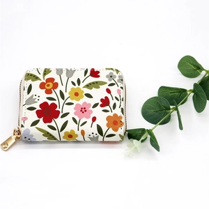 Floral print accordion card holder with gold zipper and fresh botanical flower pattern