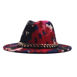 Detail of wide brim fedora with star print patterns and a gold metal chain accessory
