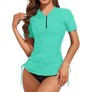 Women's mint green short sleeve surfing top with front zipper and side drawstring detail