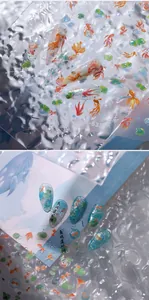 Macro detail of M-633 nail stickers with koi fish and lotus patterns on clear tips