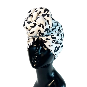 Faux suede turban hat with black and white abstract print and multi-layered knot design