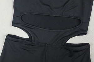 Detail of three oval cut-outs on black stretch fabric for sexy backless bodysuit