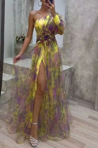 Detail of a one-shoulder tie-dye mesh maxi dress with 3D floral waist and high side slit