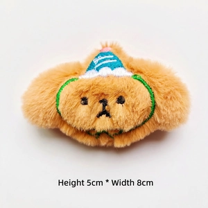 Close-up of a plush dog accessory with a party hat, size 5cm high and 8cm wide