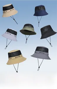 Detail of multi-color outdoor bucket hats showing breathable mesh and windproof cords