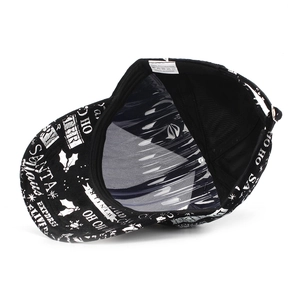 Detail view of the Christmas baseball cap showing inner lining and 100% polyester wash label