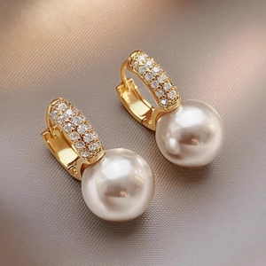 Elegant gold hoop earrings with micro-paved crystals and large white pearls for women