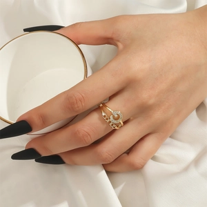 Chic adjustable gold orbital ring with sparkling zircon logo displayed on a silk background