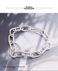 Close-up of S925 sterling silver heart and geometric spring clasps for DIY jewelry making