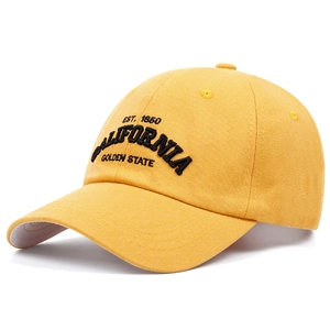 Detailed view of yellow cotton baseball cap featuring black California embroidery