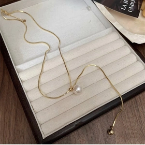 Elegant adjustable long pearl pendant necklace with gold snake chain for women