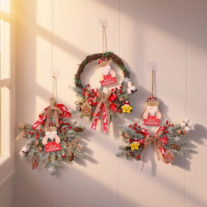 Christmas wreath and snowflake door hangings with Santa, berries and pine cones