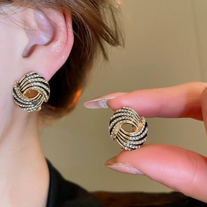 Vintage irregular geometric gold and black enamel stud earrings with shimmering rhinestones