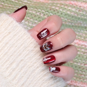 Deep red cat eye press-on nails with traditional Chinese lion and firework art