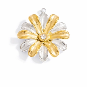 Macro detail of two-tone flower pendant featuring a sparkling center zircon stone