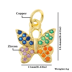 Detail view of copper butterfly pendant with zircon inlay showing 15.6mm height dimension