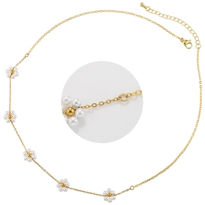 Detail view of 18K gold plated necklace with five elegant pearl flower pendants