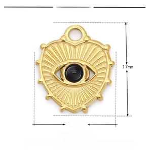 Detail of a 15x17mm gold stainless steel heart pendant with black evil eye stone