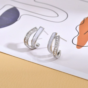Minimalist double-layered silver stud earrings with sparkling cubic zirconia and white enamel